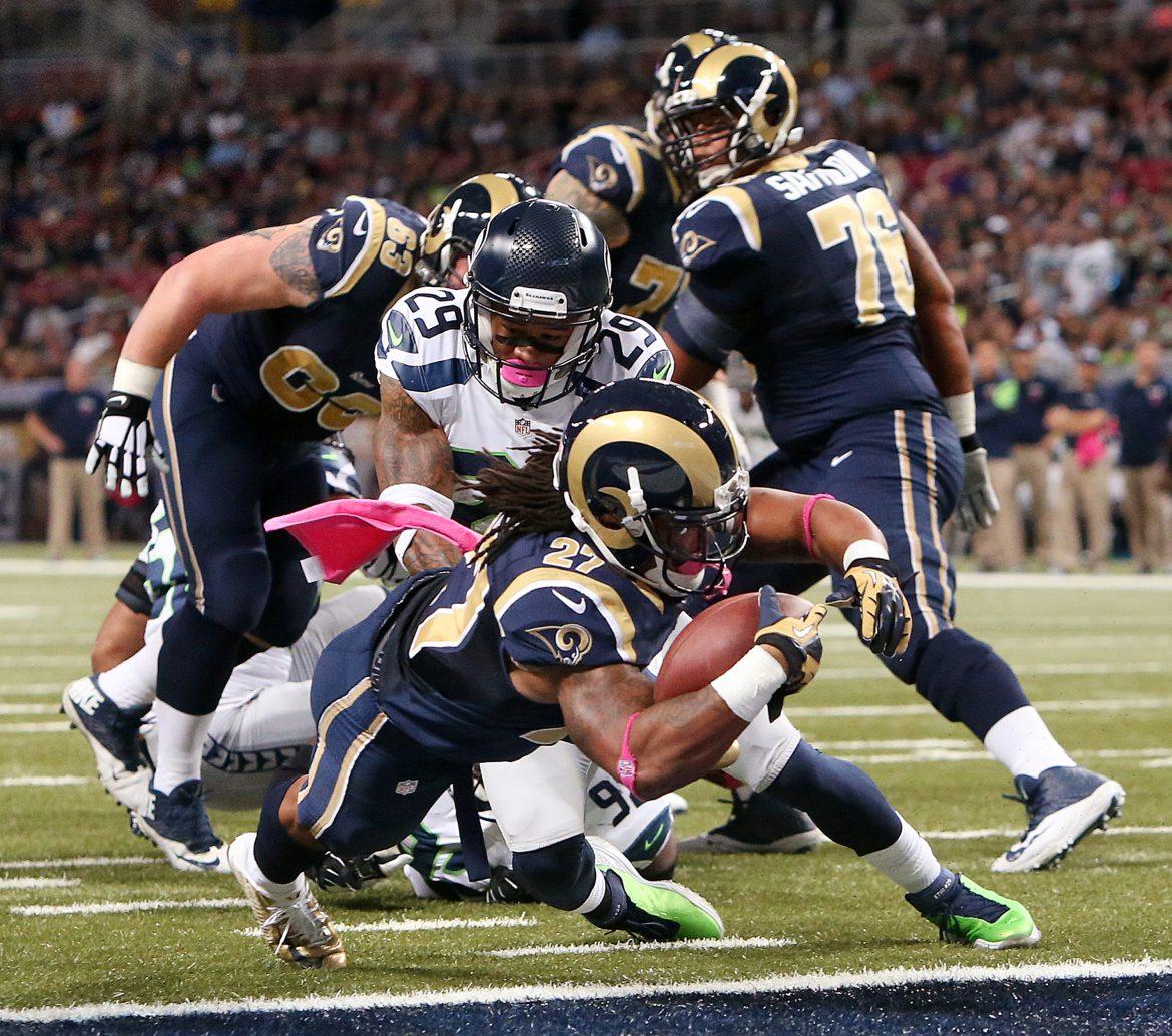 St. Louis Rams running back Tre Mason dives into the endzone past Seattle Seahawks free safety Earl Thomas (29) as he scores on a six-yard touchdown run during the first quarter on Sunday, Oct. 19, 2014, at Edward Jones Dome in St. Louis. (Courtesy of MCT)