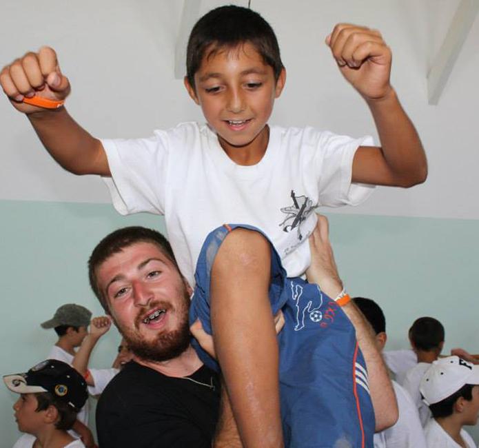 Dickran Khodanian, 21, senior, history major, volunteering this past summer at a day camp in Proshyan, Armenia, with the AYF Youth Corps program.
