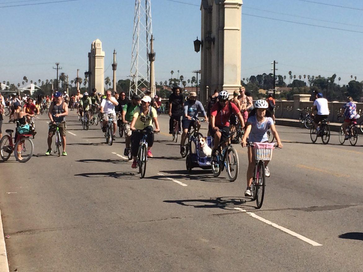 CicLAvia human and canine riders cross 4th Street bridge heading back into downtown L.A. Priscilla Ross/The Sundial.