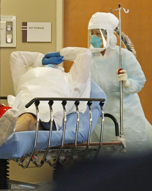A patient transported from Frisco, Texas, with concerns of possible exposure to Ebola, arrives at Texas Health Presbyterian Hospital in Dallas on Wednesday, Oct. 8, 2014. (Louis DeLuca/Dallas Morning News/MCT).