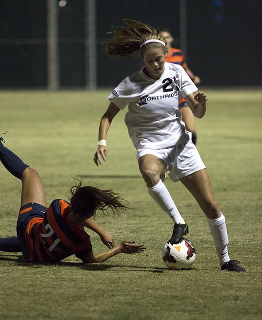 Freshman Kiley Norkus was still standing after jostiling for the ball against Cal State Fullerton's Kaycee Hoove during the Matadors' match on Oct. 19, 2014. The Matadors were unable to keep up their win streak in the Big West Conference, losing to the Titans 1-0. Photo Credit: Trevor Stamp/ Senior Photographer