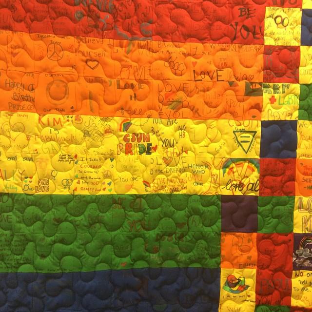 Acceptance, love and personal struggles, and triumphs are common themes among the messages that decorate more than 120 fabric squares of the commemorative community quilt that hangs in the CSUN Pride Center. Photo credit Allessandra Lopez/The Sundial