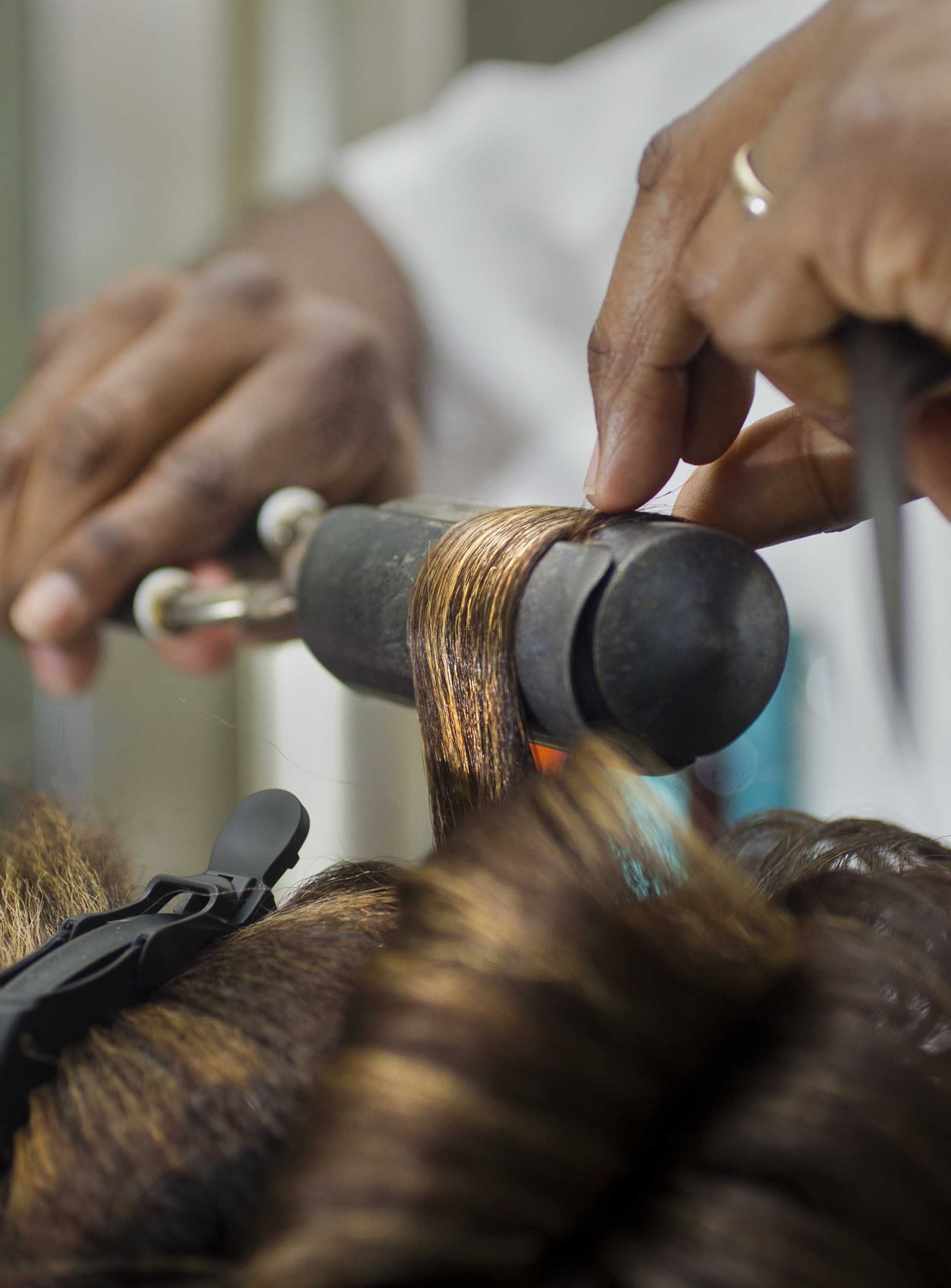 Some women get their hair done with a curling iron for their dates. (Allison Long/Kansas City Star/MCT)