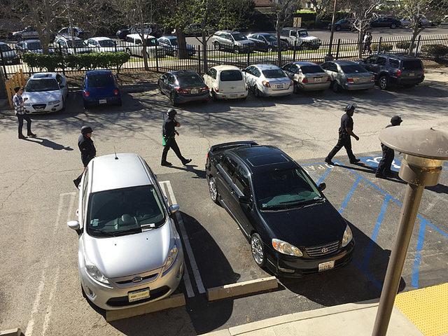 Armed police enter CSUN dorms in search of shooting suspects on March 5. (Leni Maiai / Contributor)