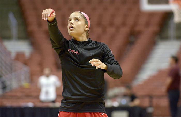 Senior Ashlee Guay warms up before the Big West Conference Championship game versus the University of Hawaii in the Honda Center on March 14. (Raul Martinez/ Staff Photographer)