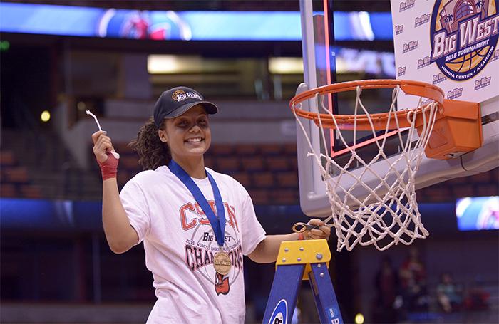 Ashlee Guay and the CSUN Matadors celebrate thier back-to-back title in the Big West Conference by cutting the net  after deefeating Hawaii by a final score of 67-60 at the Honda Center on March 14. (Raul Martinez/ Staff Photographer)