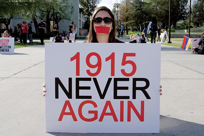 Students partake in a silent protest during the 100 Days of Action, in effort to commemorate the Armenian Genocide in front of the Oviatt Library, Feb. 5, 2015. (Matthew Delgado/Staff Photographer)