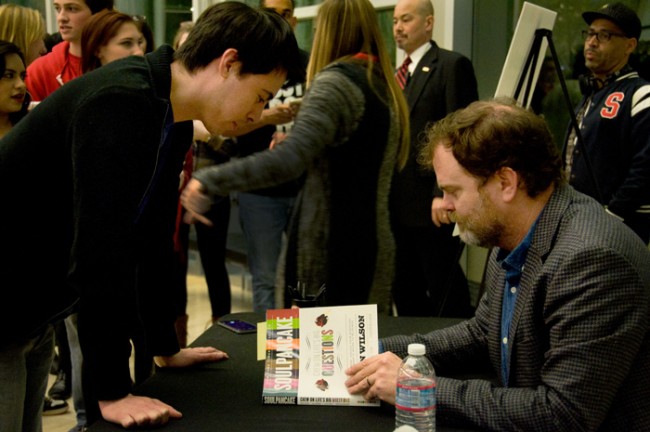 Rainn Wilson signs copies of SoulPancake books sold at the Valley Performing Arts Center for CSUN students. (Cladellain Kae David / Photo Editor)