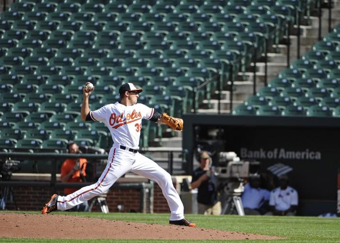 Baltimore Orioles pitcher Kevin Gausman pitches against the Chicago White Sox during the eighth inning on Wednesday, April 29, 2015, at Camden Yards in Baltimore. The game was closed to the public due to unrest in the city this week. (Kenneth K. Lam/Baltimore Sun/TNS)