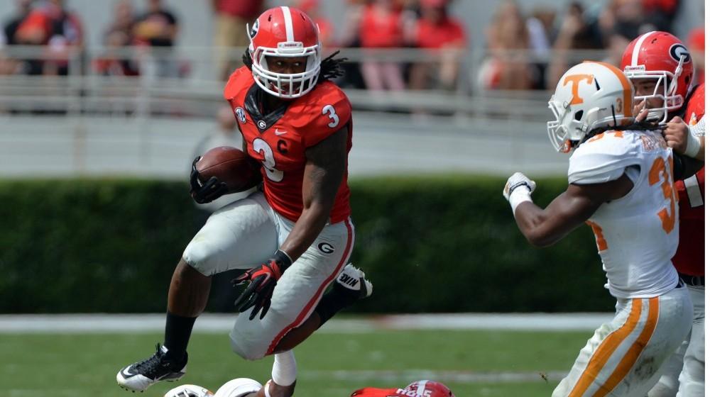 Georgia Bulldogs running back Todd Gurley (3) leaps over a Tennessee defender during the second quarter at Sanford Stadium Saturday, Sept. 27, 2014 in Athens, Ga. The Bulldogs won 35-32. (Brant Sanderlin/Atlanta Journal-Constitution/MCT)