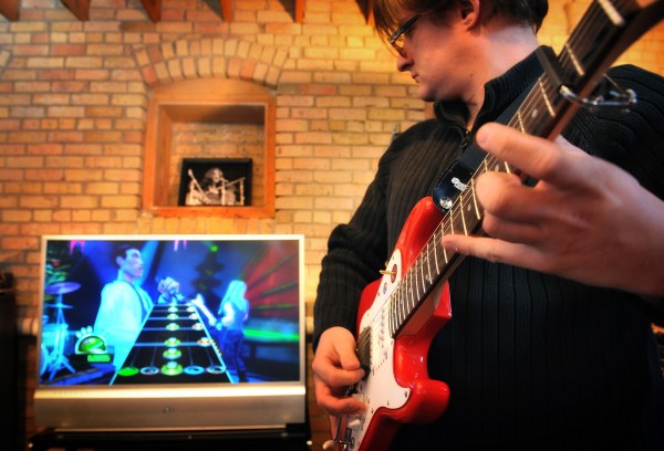 Zivix software engineer Jason Nelson plays a round of Guitar Hero on a Zivix Headliner digital guitar, March 1, 2009, in Minneapolis, Minnesota. (Glen Stubbe/Minneapolis Star Tribune/MCT)