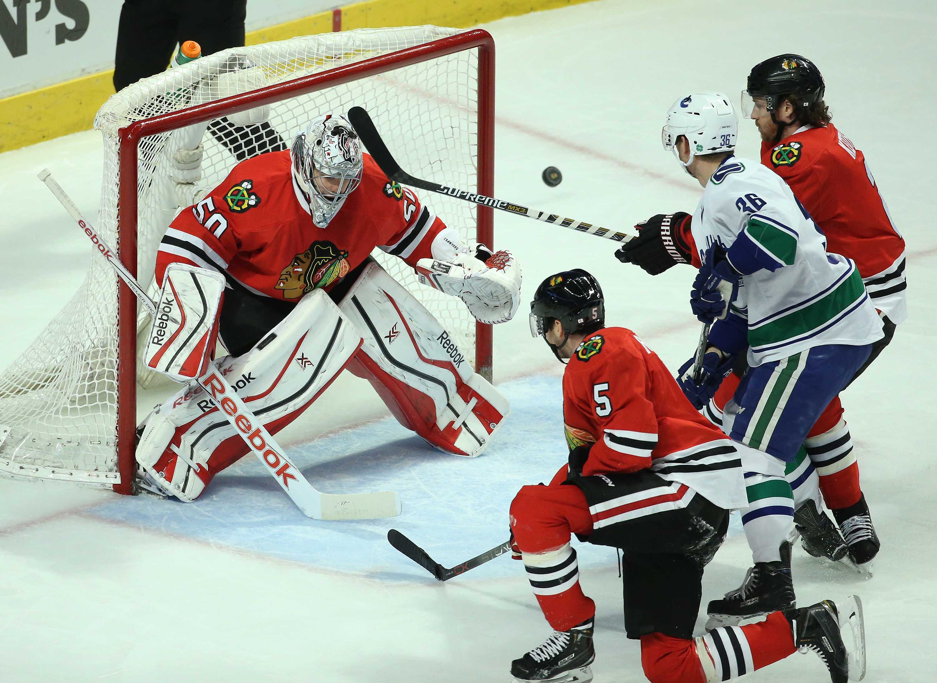 Chicago Blackhawks goalie Corey Crawford (50) defends his net against the Vancouver Canucks in the second period at the United Center in Chicago on Wednesday, Feb. 11, 2015. (John J. Kim/Chicago Tribune/TNS)