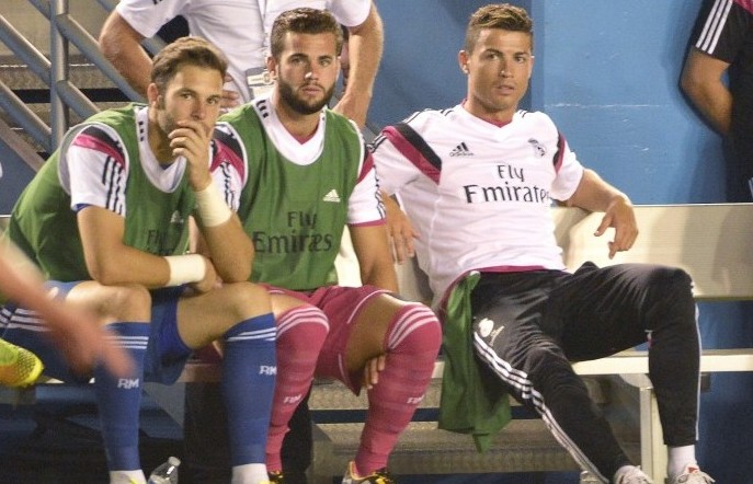 Real Madrid's Cristiano Ronaldo, right, watches from the bench as his team plays AS Roma in the Guinness International Champions Cup at the Cotton Bowl in Dallas on Tuesday, July 29, 2014. (Max Faulkner/Fort Worth Star-Telegram/MCT)
