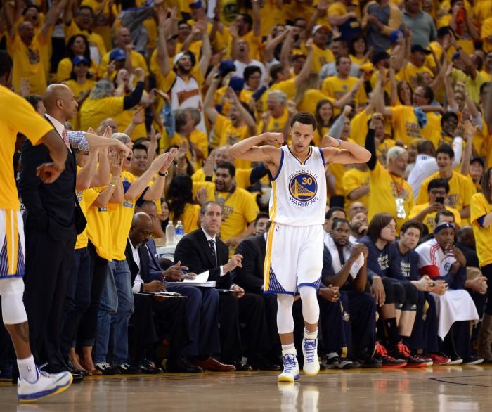 The Golden State Warriors Stephen Curry (30) celebrates a basket and drawing a foul against the New Orleans Pelicans in the second quarter of Game 1 in the first round of the NBA playoffs at Oracle Arena in Oakland, Calif., on Saturday, April 18, 2015. (Dan Honda/Bay Area News Group/TNS)