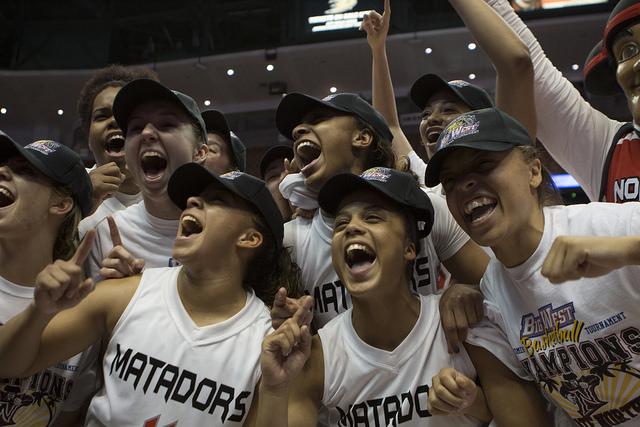 The Matadors celebrate after winning their first Big West Conference Championship against Cal Poly Mustangs at the Honda Center, 73-58. Photo credit: Trevor Stamp