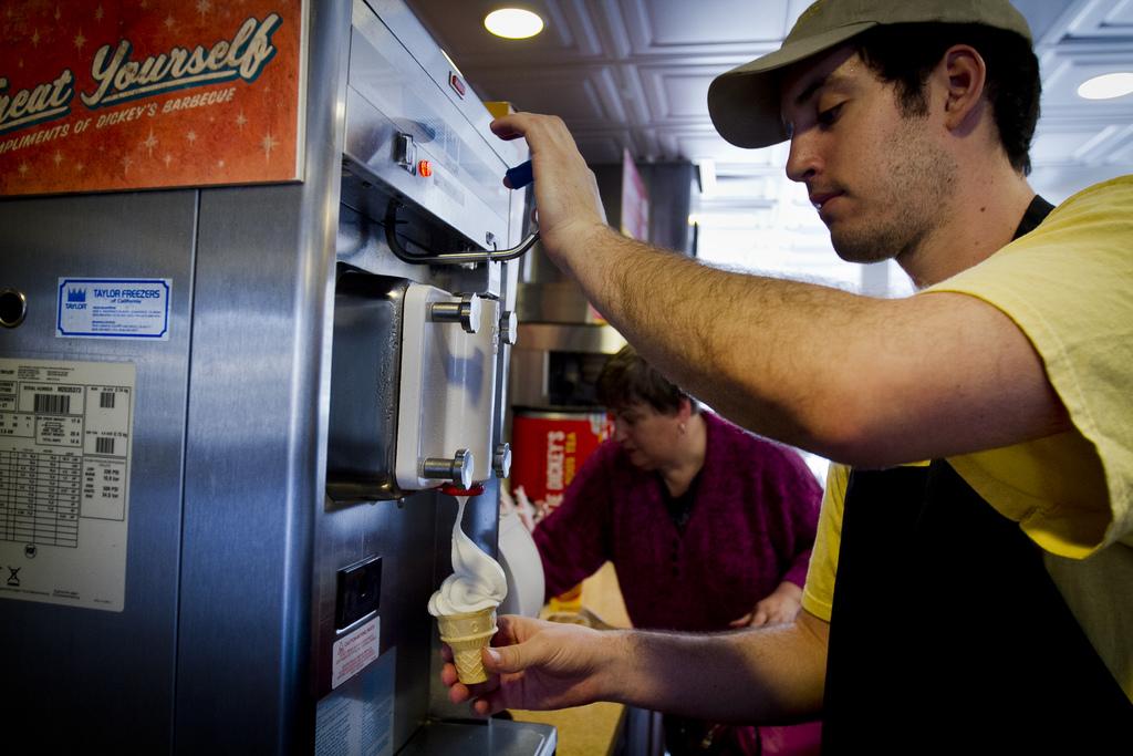 An employee serves ice cream on his work shift at Dickeys BBQ in Northridge. File Photo / The Sundial