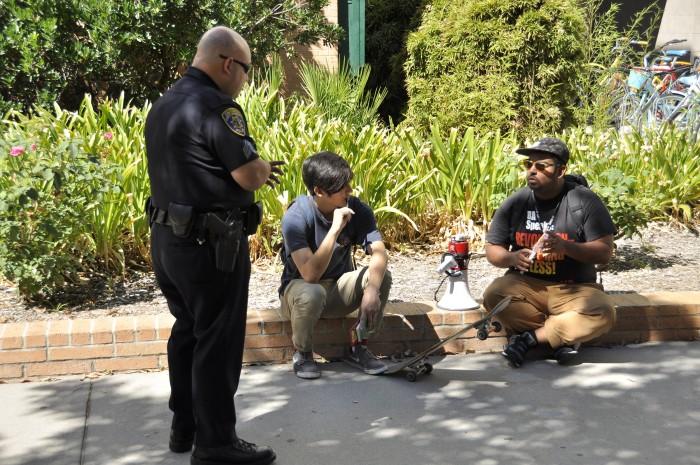 A police officer has a conversation with CSUN student.