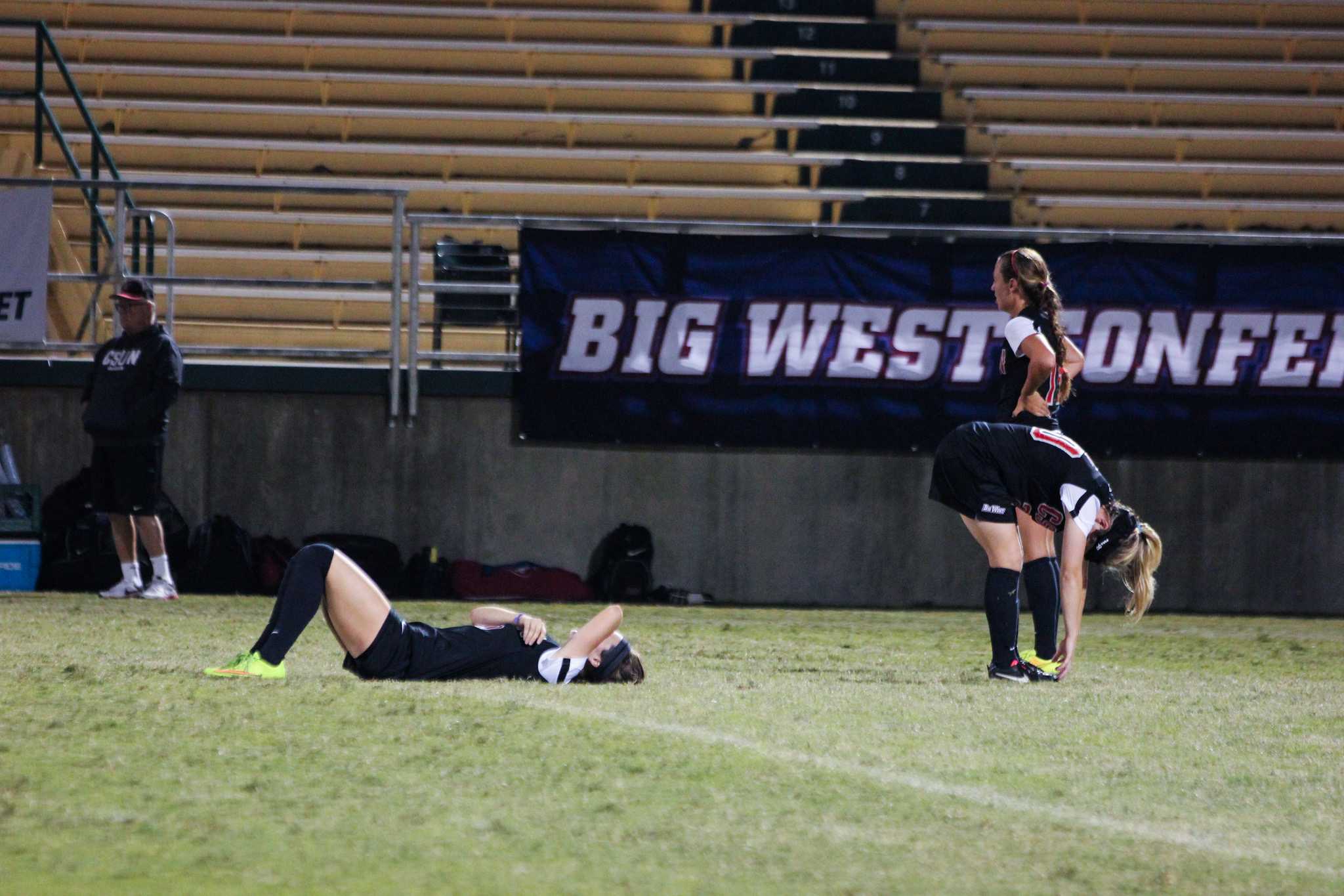 CSUN soccer player taking a break from a game as they prepare to continue to play.