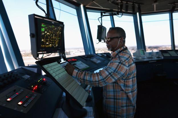Robert Moreland monitors the conditions in the control room at Opa-Locka Airport.