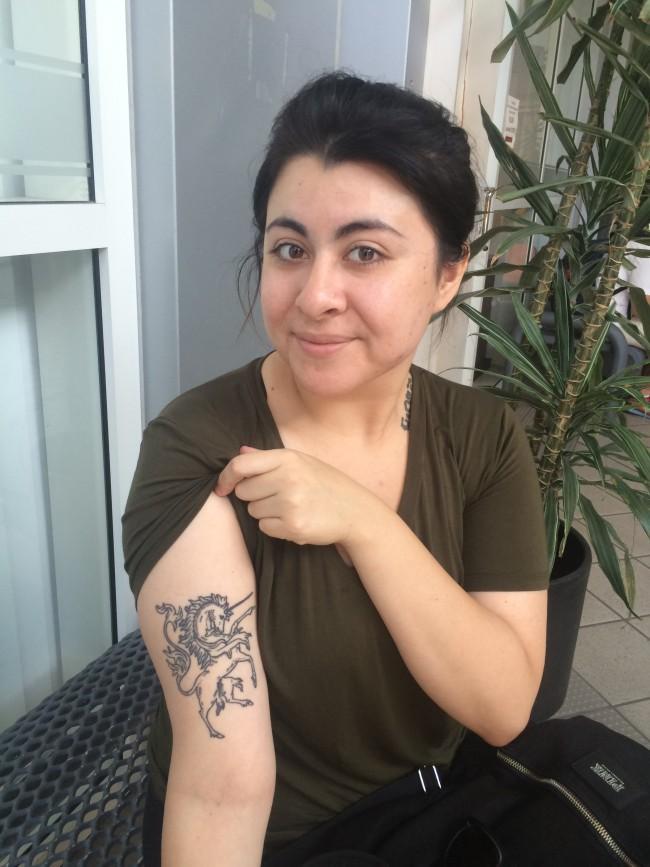 Eva Lopez proudly shows off her favorite and most recent tattoo. Photo credit: Julissa Vasquez