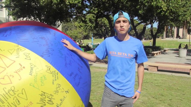 Students part of Beta Beta Tai takes picutres with giant ball around campus for Children Hospital in LA.