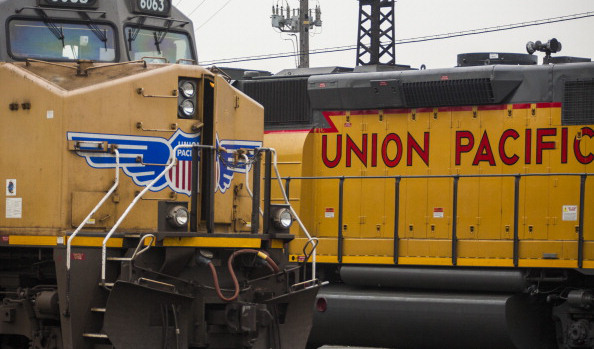 Two trains passing each other. One that reads, Union Pacific