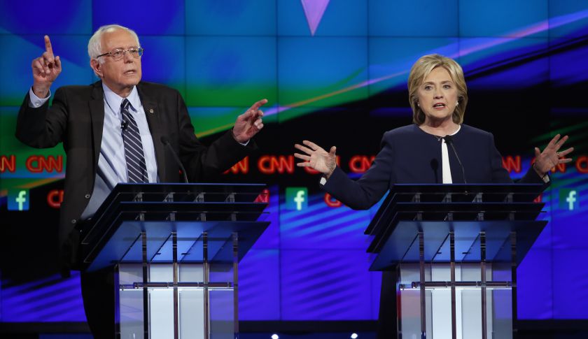 Democratic presidential candidates U.S. Senator Bernie Sanders (L) and former Secretary of State Hillary Clinton debate duringthe first official Democratic candidates debate of the 2016 presidential campaign in Las Vegas, Nevada October 13, 2015.  REUTERS/Lucy Nicholson (TPX IMAGES OF THE DAY)   - RTS4CPX