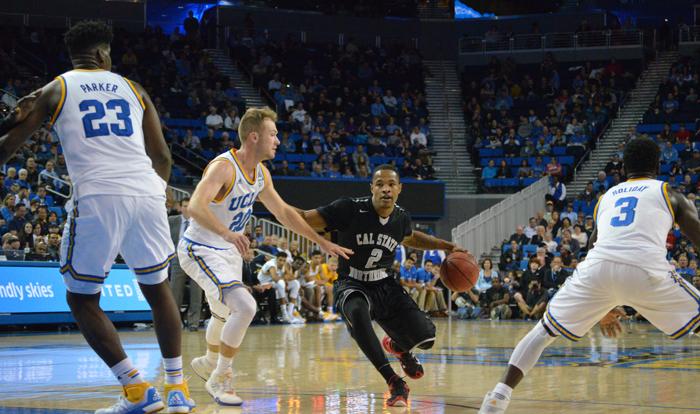 CSUN senior guard Landon Drew splits the defense to get into the paint against UCLA as the Matadors felll by a final score of 77-453  at the Pauley Pavillion on Sunday Nov. 29, 2015. (Raul Martinez / The Sundial)