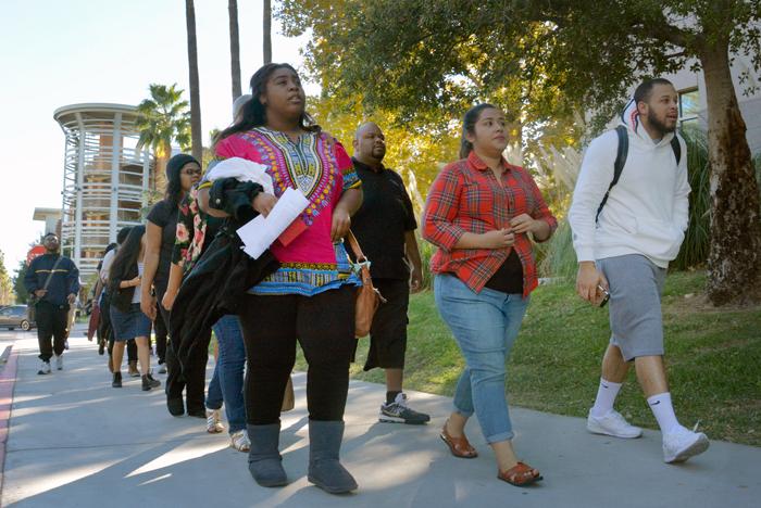 CSUN walk together into President Dianne Harris office to deliver her a letter for a meeting demand on Thursday, Nov. 19, 2015. (Raul Martinez / The Sundial)