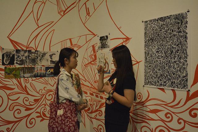 Minyi Liang, illustration student, and Minting Li, graphic design major at the CSUN gallery. Ellen Choi / Sundial