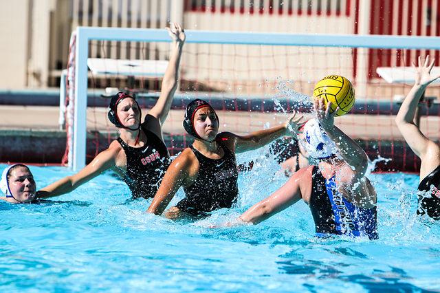 CSUN water polo athletes defend goal