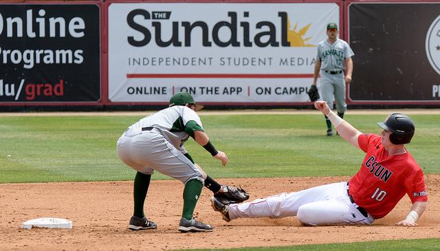 CSUN baseball athlete slides into base and gets tagged by opponent