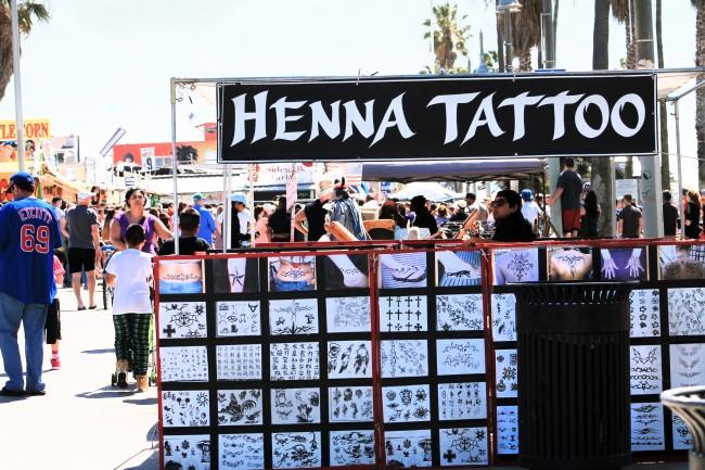 Over twelve henna pop up shops can be seen along the Venice Beach boardwalk, offering "black henna" tattoos full of dangerous chemicals to passer bys. (Ashley Grant/ The Sundial)