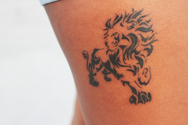Davina McKenzie, 18, a business management major shows off her zodiac sign tattoo located on her upper right thigh. (Ashley Grant/The Sundial)