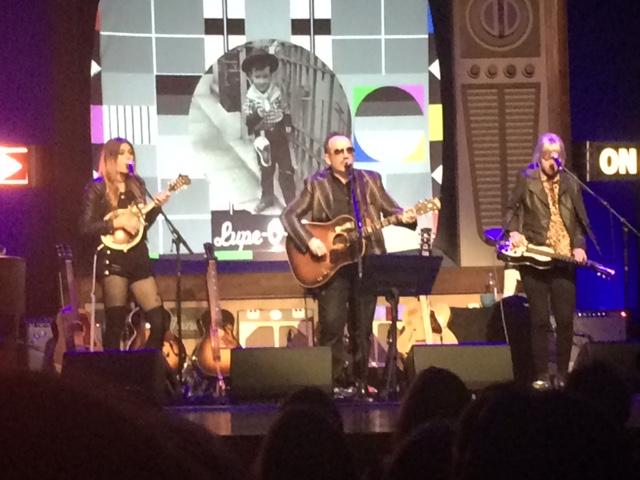 Larkin Poe and Elvis Costello perform on stage