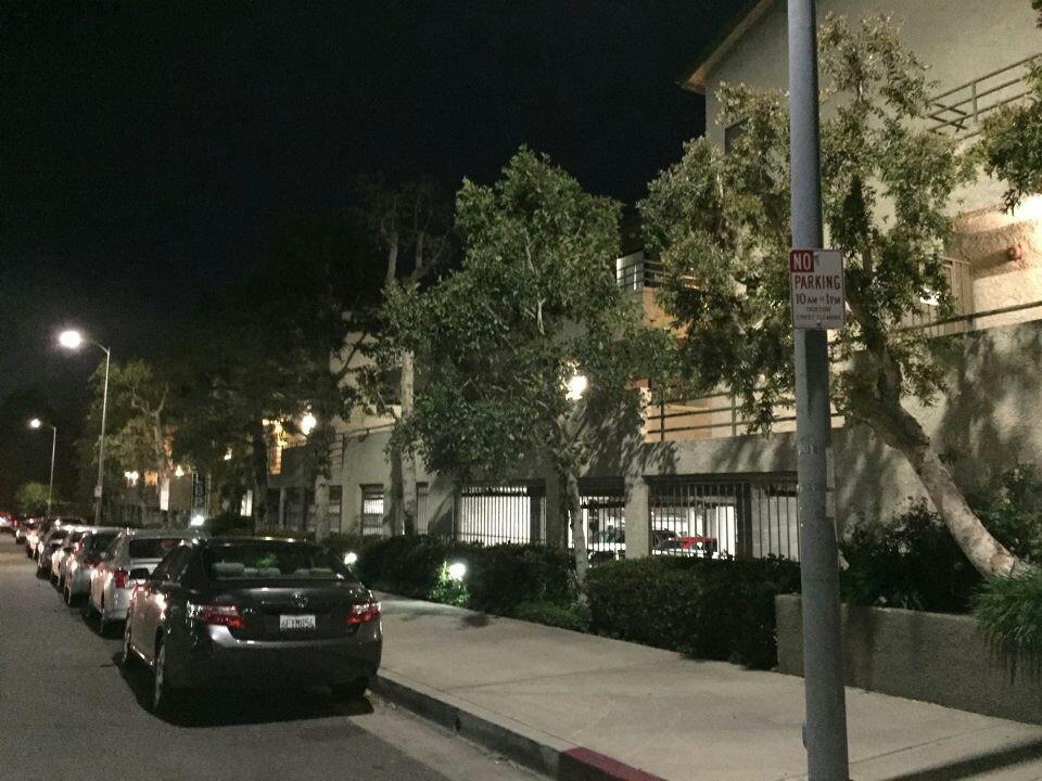 Image of cars parked outside apartment complex