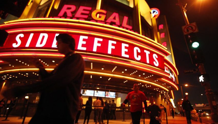 People walk outside Regal Theater