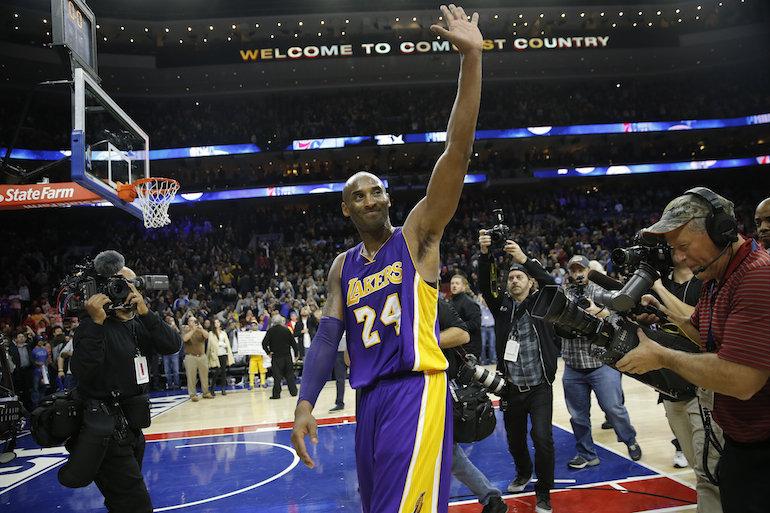 Kobe Bryant waves to crowd