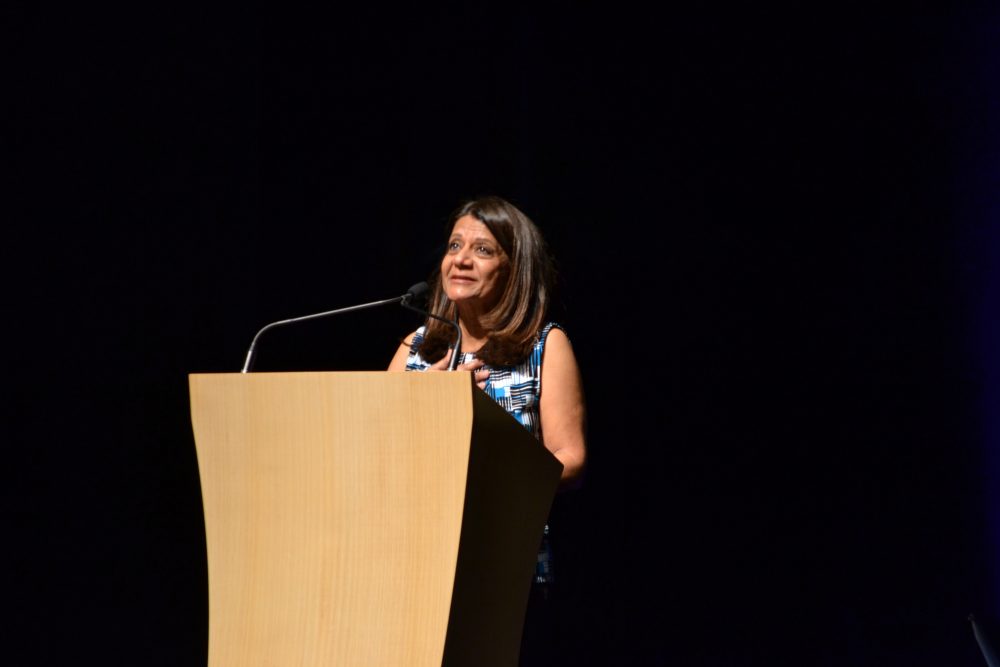 Associate Director for CSUN Educational Opportunity Prorgrams, Shiva Parsa held back tears at the podium as she vowed to continue EOP's mission in Jose Luis Vargas's honor. (Eric Licas/ The Sundial)