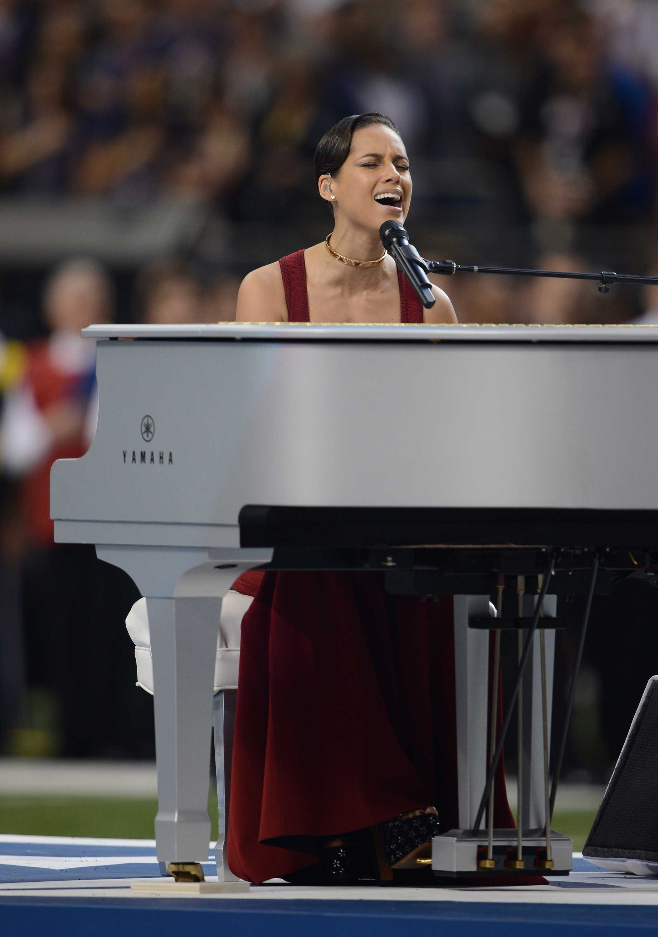 Alicia Keys plays the piano and sings