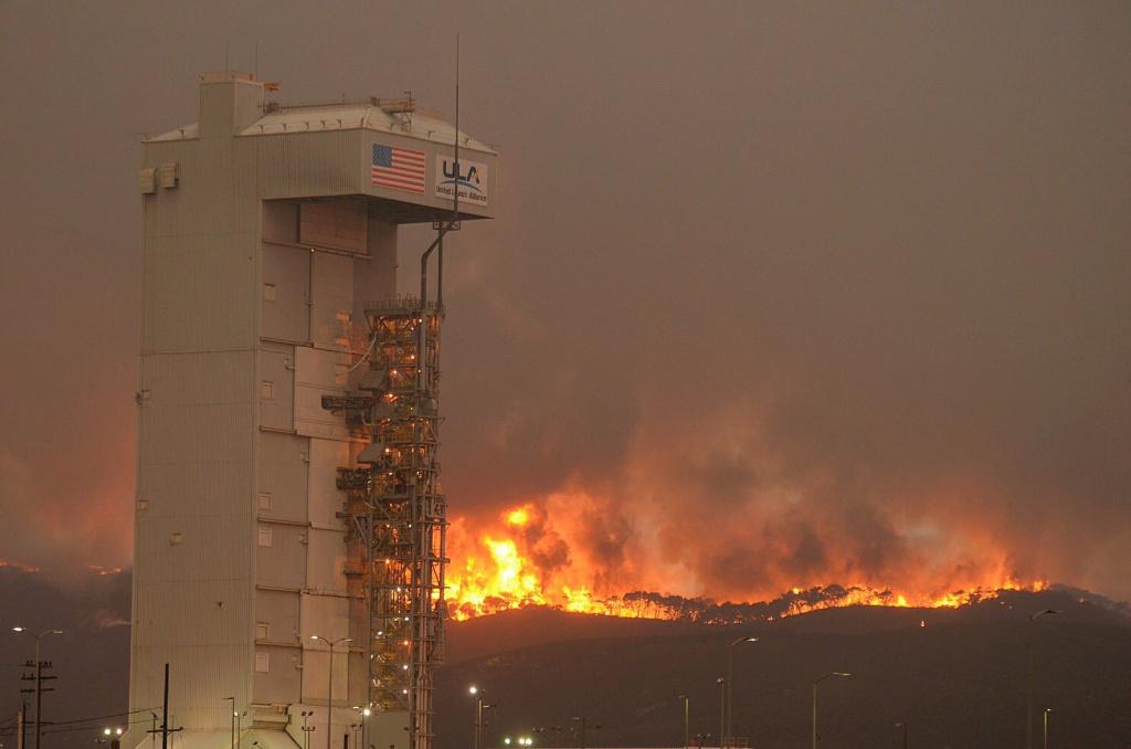 fire shown behind air force base