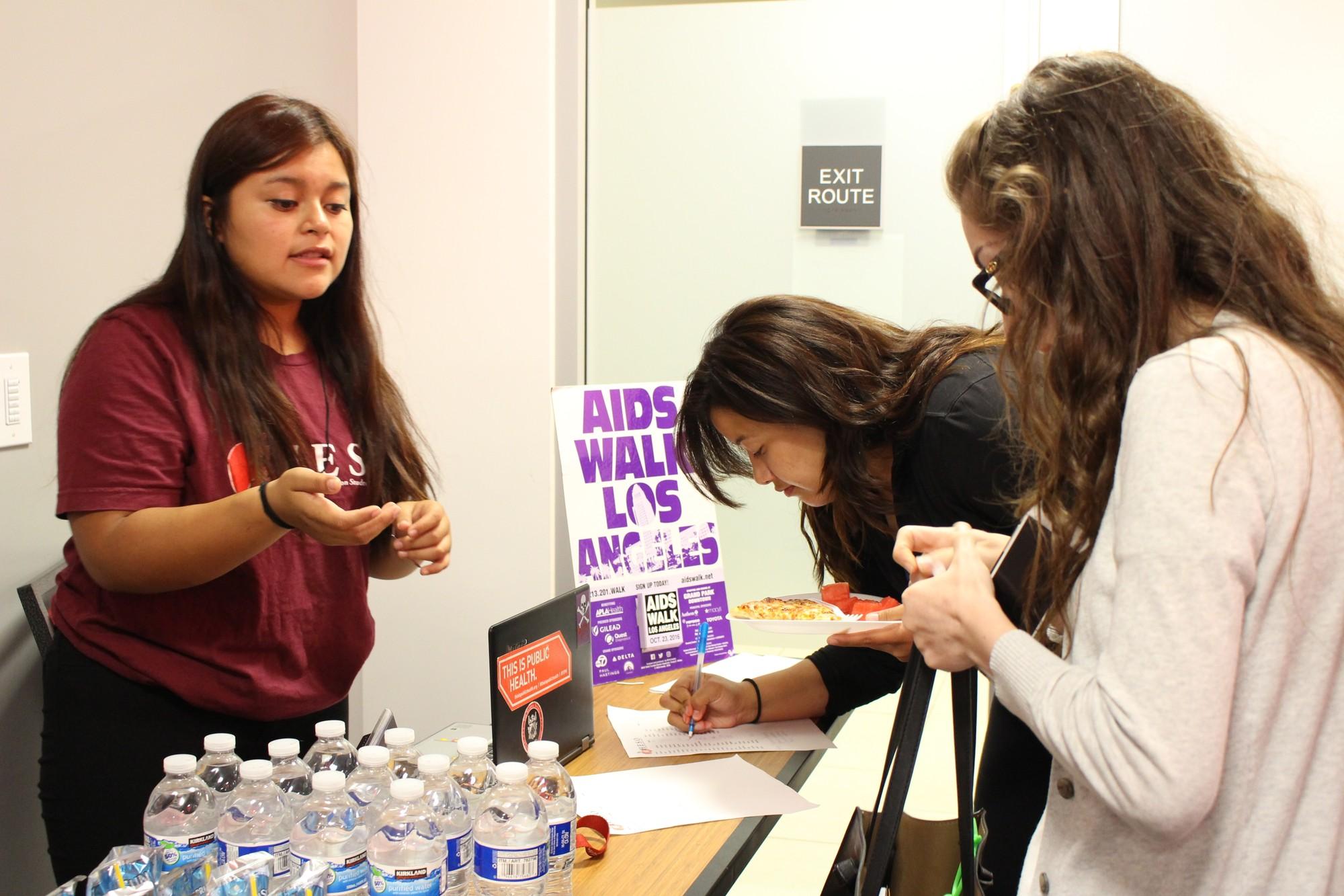 students sign up for AIDS walk