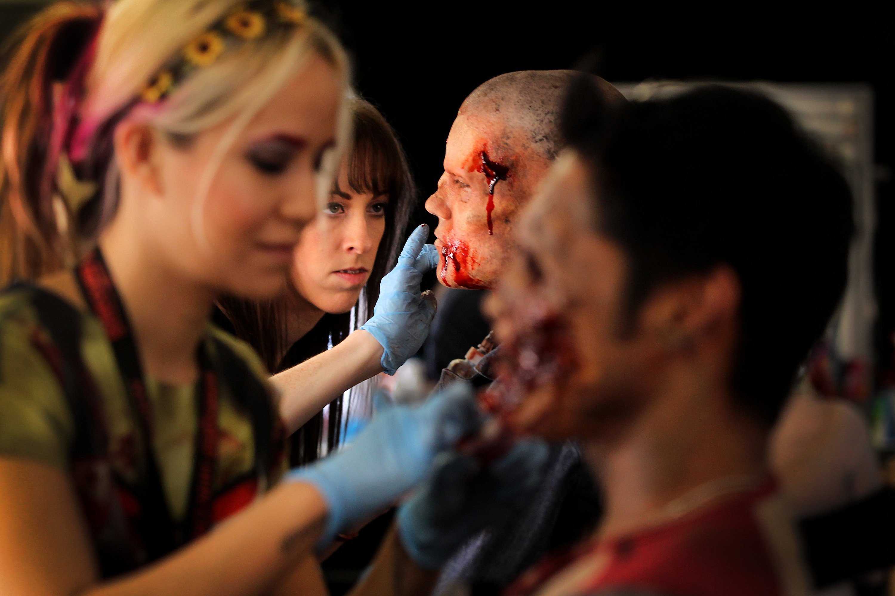 Bloody-looking+makeup+being+applied+to+actors+faces