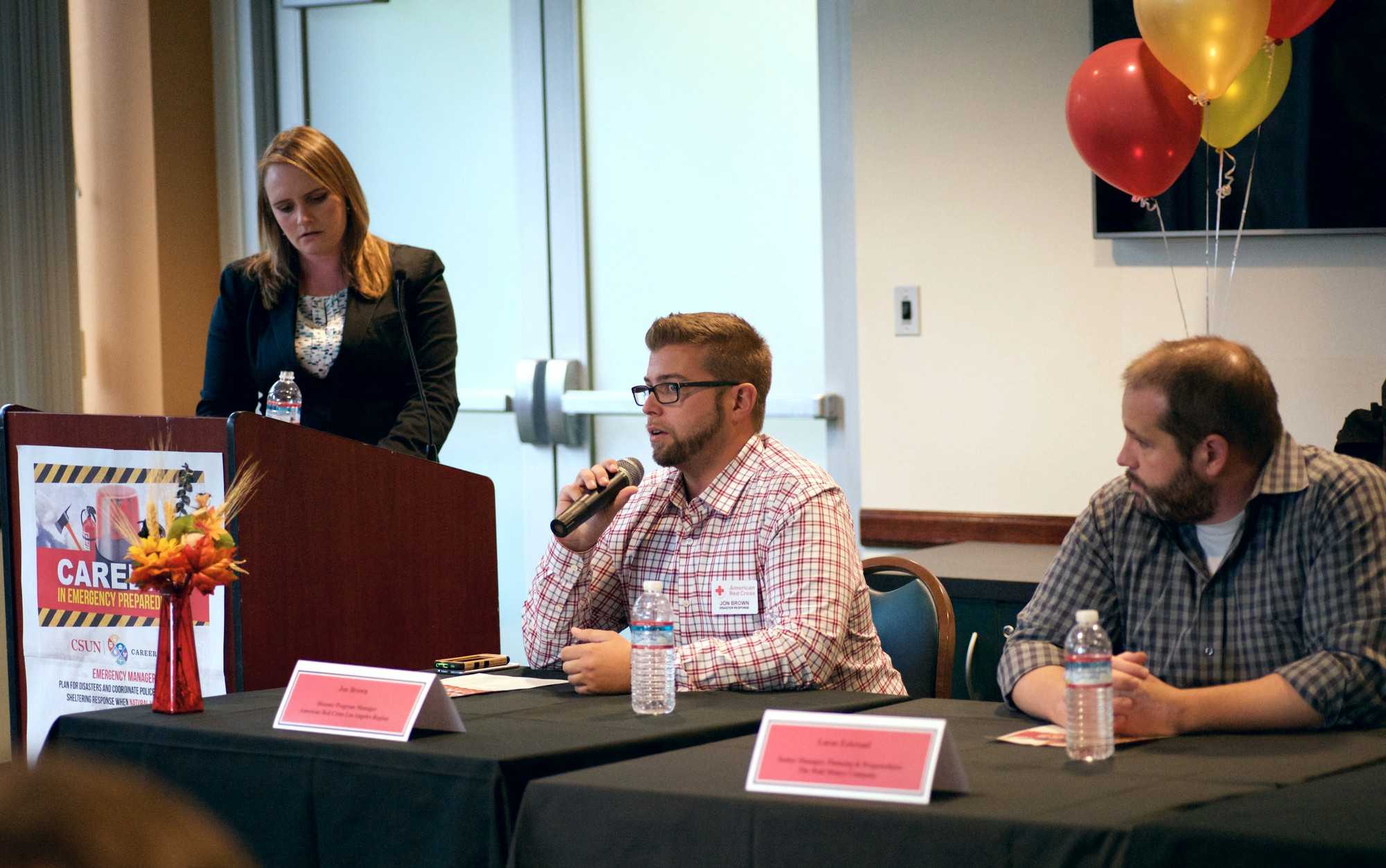 Three people speak at emergency preparedness panel