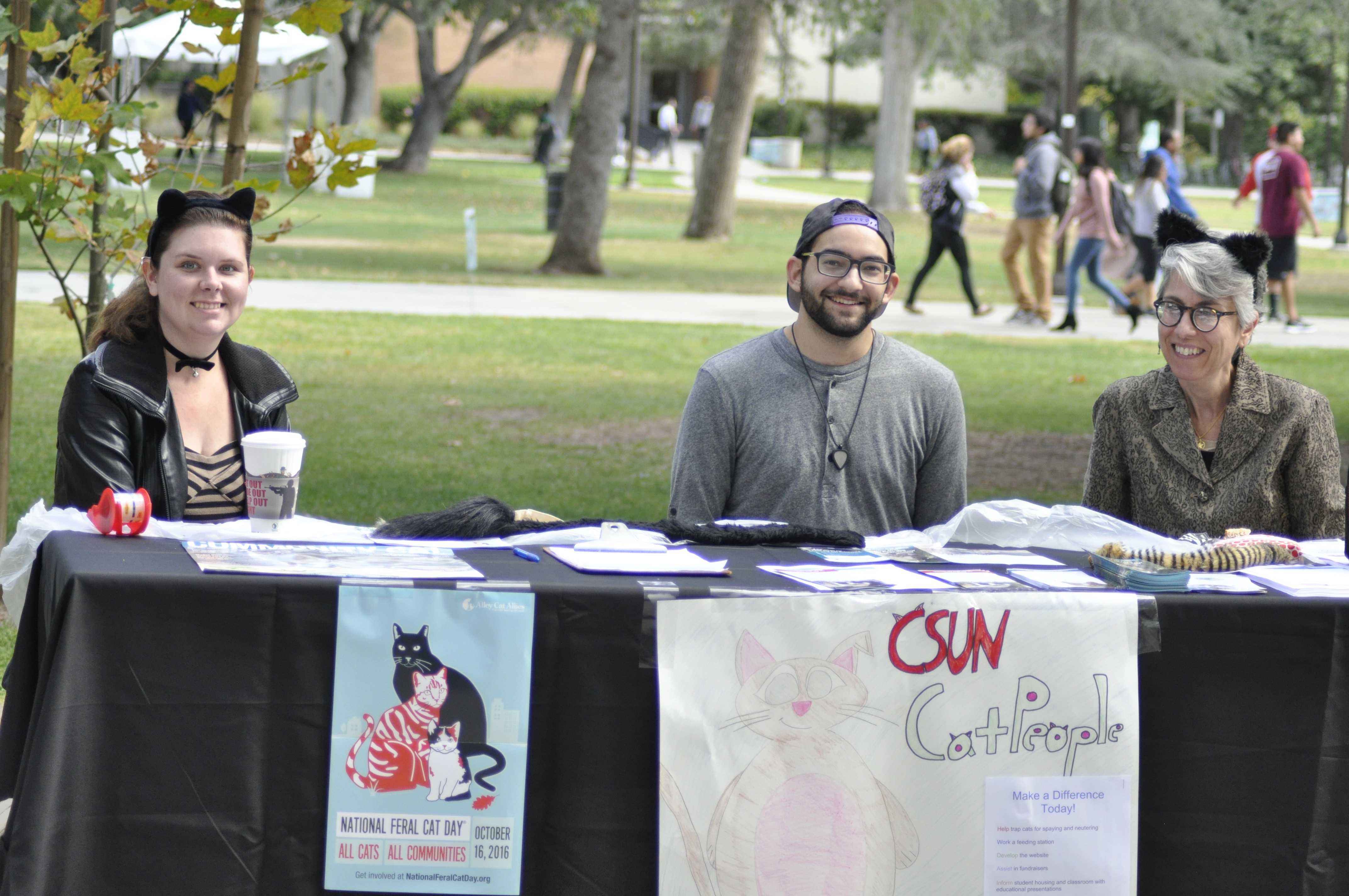 Emily Siffrin, Darian Eskan and CSUN Cat People founder Sabina Magliocco at the National Feral Cat Day Booth on October 17, 2016 in the Oviatt Square Photo credit: Harrison Katz