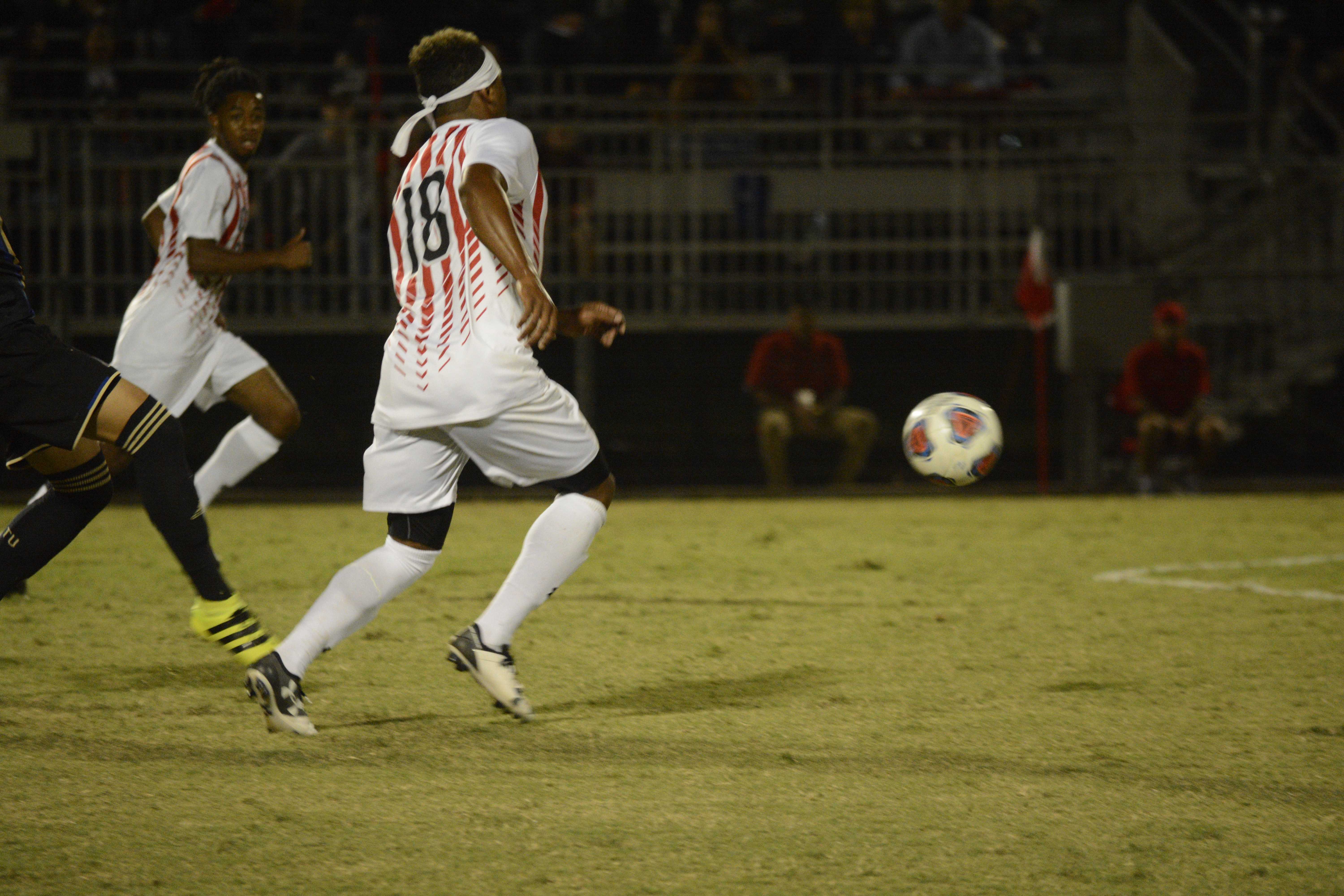 CSUN soccer players chase down the ball