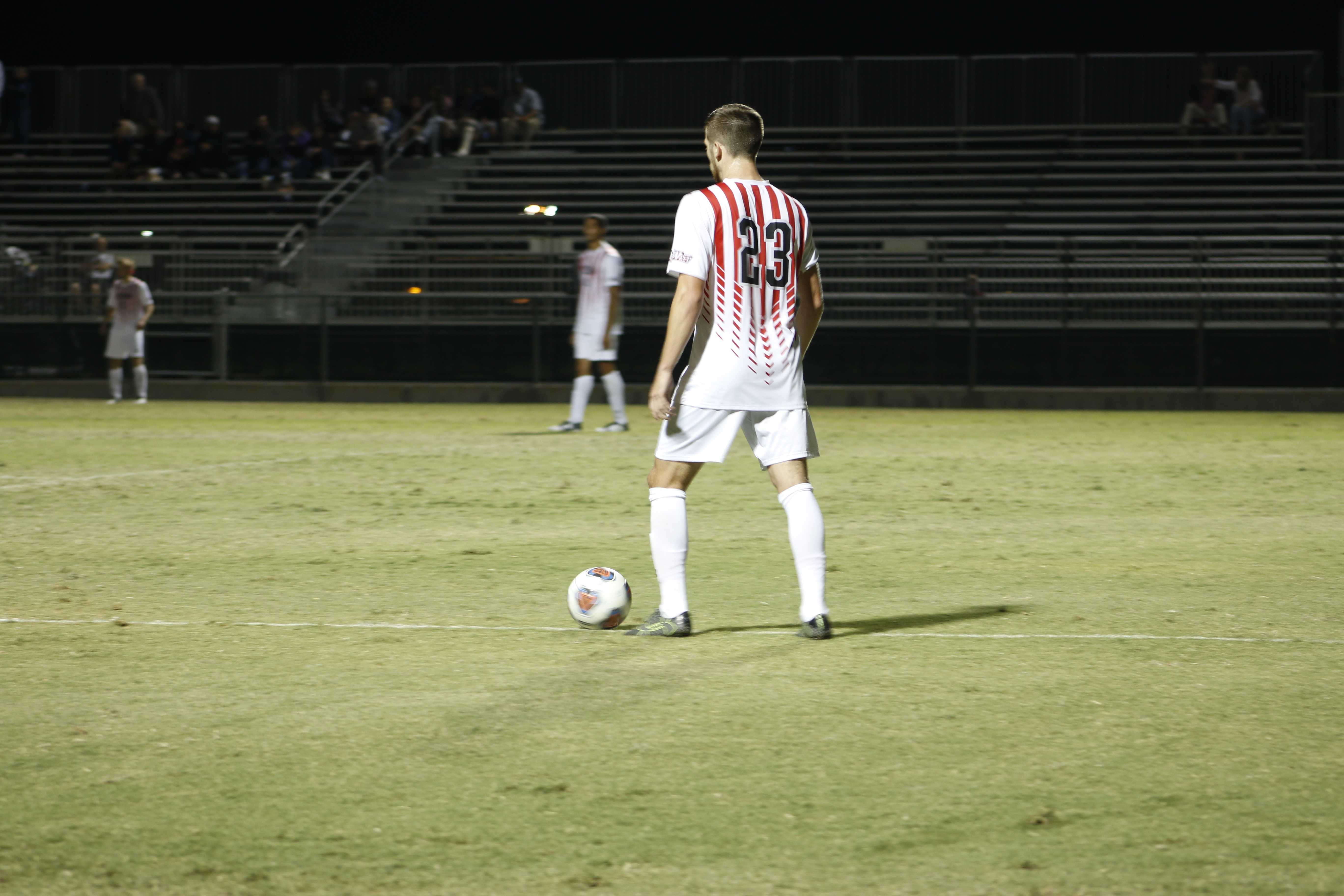 Patrick Hickman holds on to the ball while deciding which teammate to kick it to Photo credit: Kendall Faulkner