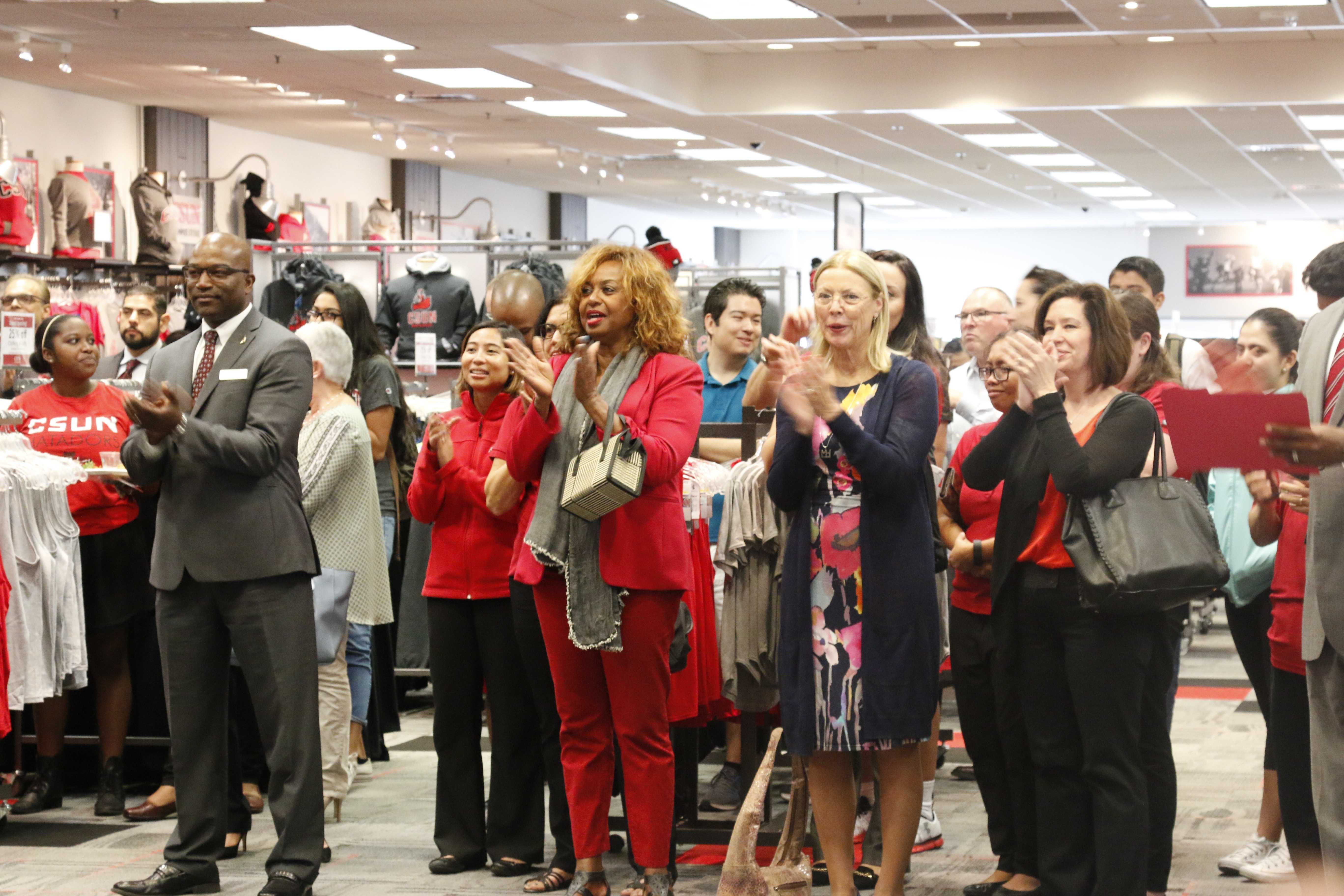 CSUN employees give applause for the reopening of the CSUN campus store