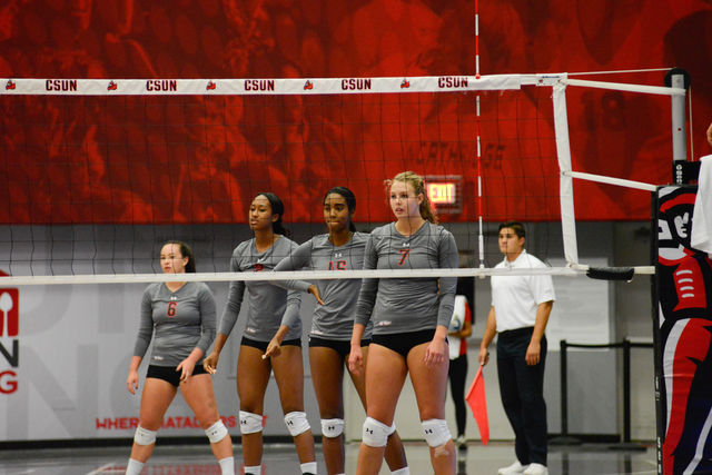 CSUN+volleyball+team+stands+in+formation+before+the+game+begins+again