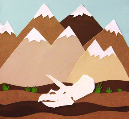 Illustrated picture shows dinosaur skull in the mountains